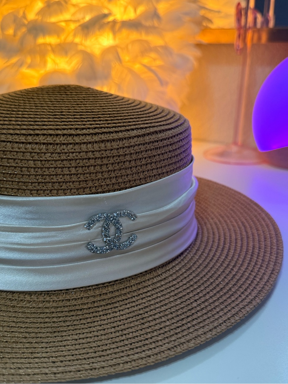 CHANEL Brown Straw Boater Hat with White Satin Band and Crystal CC